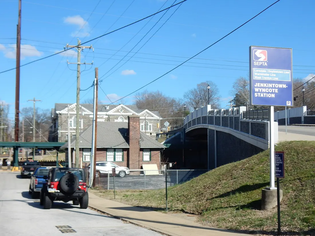 Greenwood Avenue bridge over railroad and Tacony (or Tookany), Montgomery county, Pennsylvania. It is located near Jenkintown-Wyncote SEPTA station and connects Jenkintown and Wyncote. North view. March 2020.