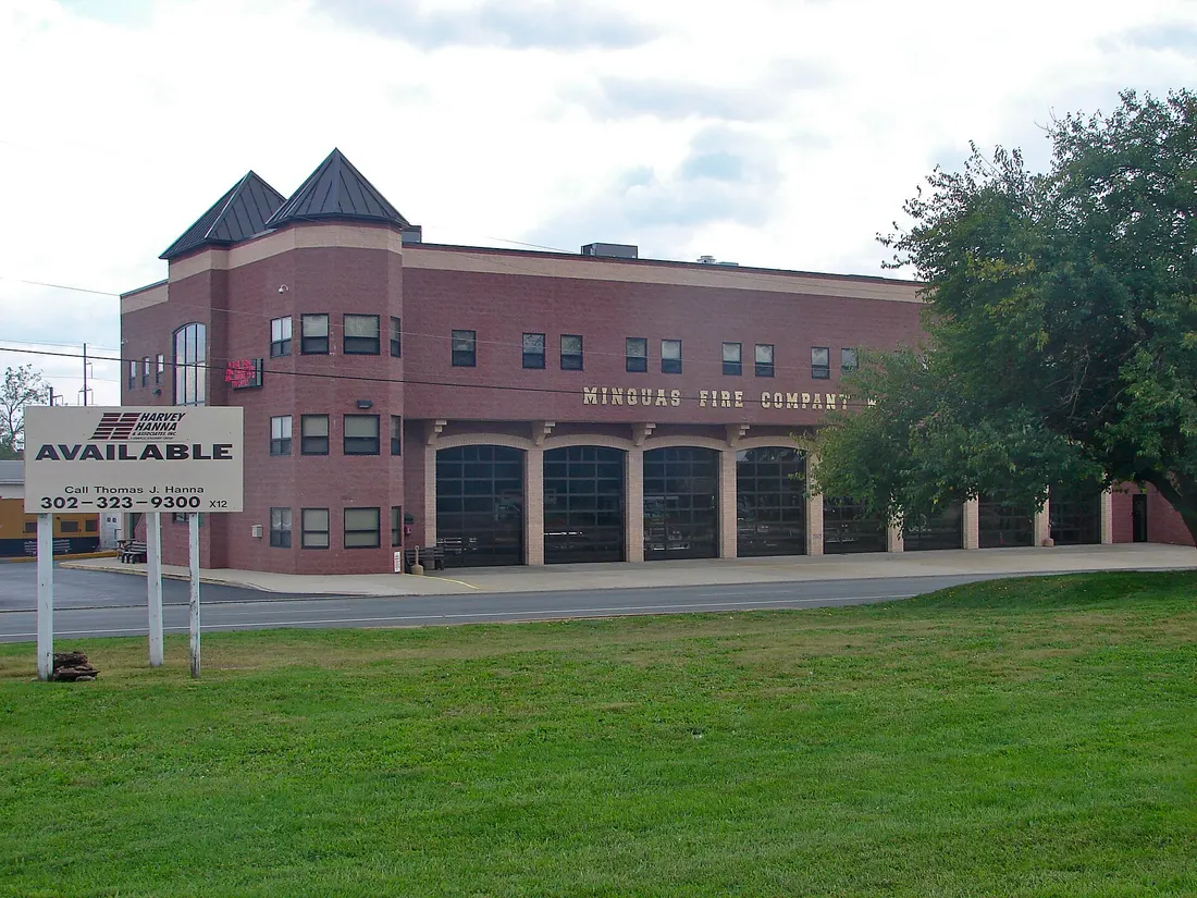 Minquas Fire Department in Newport, Delaware. The empty lot(s) in front of it (the green grass) are the former sites of two (2) current NRHP sites. Joseph Killgore House 107 N. James St. and Killgore Hall, 101 N. James