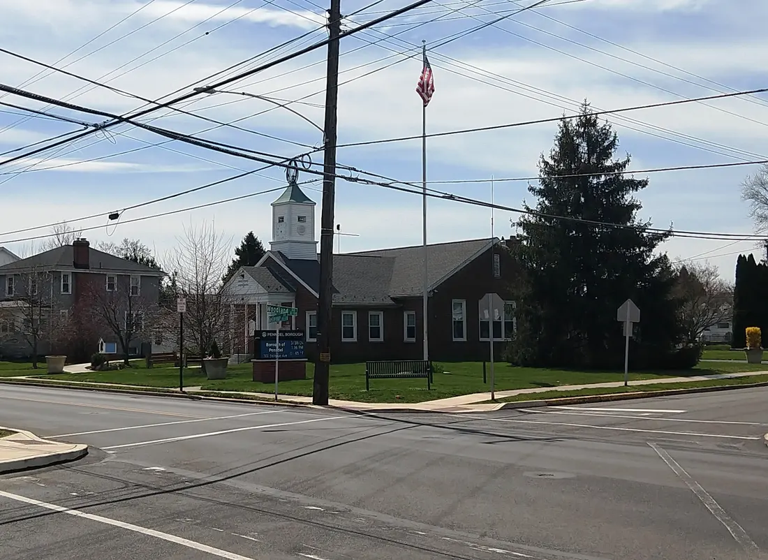 Photo of the Penndel, Pennsylvania borough hall. Photo taken from Woodland Avenue at Bellevue Avenue (Pennsylvania Route 413) looking southwest.