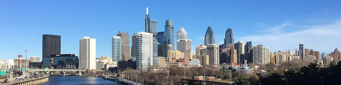 The skyline of Philadelphia, Pennsylvania viewed from the South Street Bridge over the Schuylkill River. If on Wikipedia, see the fully annotated version on the Wikimedia page.