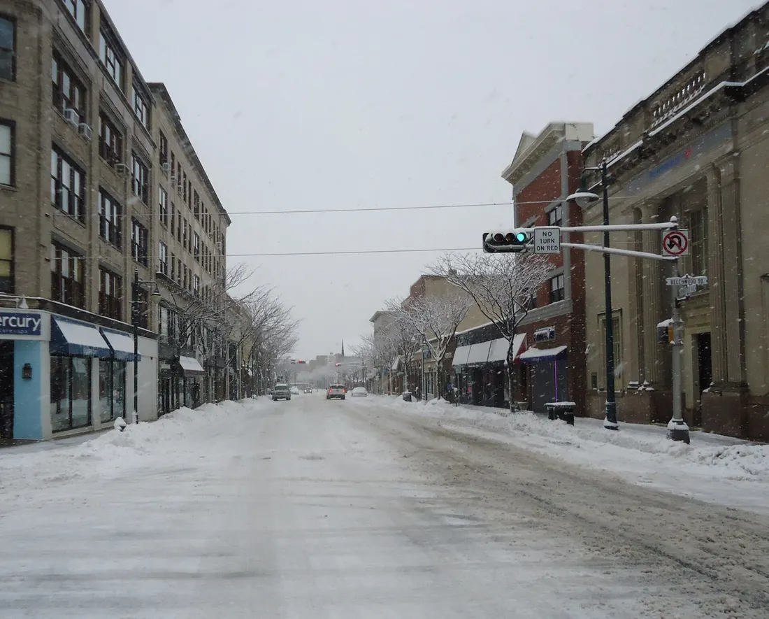 Looking west on Springfield Avenue in downtown Summit, New Jersey, after a snowfall, with streets plowed.