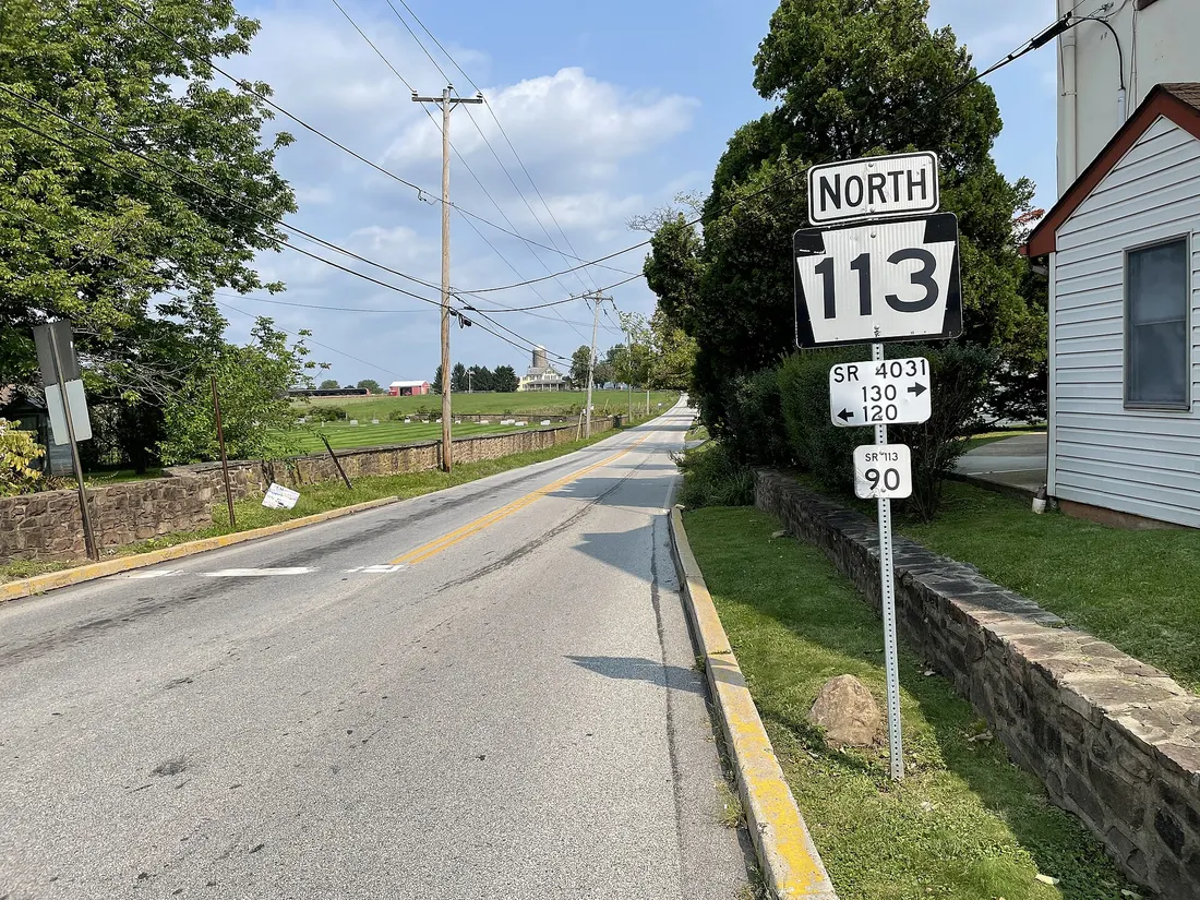 Northbound Pennsylvania Route 113 (3rd Avenue) past the intersection with Main Street in Trappe, Pennsylvania