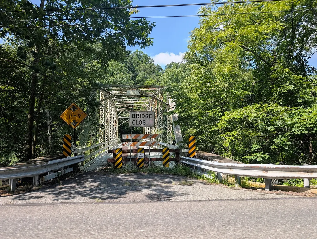 Photo of a head-on view of the closed Snyders Road bridge carrying the road over the Perkiomen Creek in Marlborough Township, Pennsylvania (which continues into Upper Frederick Township). Photo taken from Pennsylvania Ro