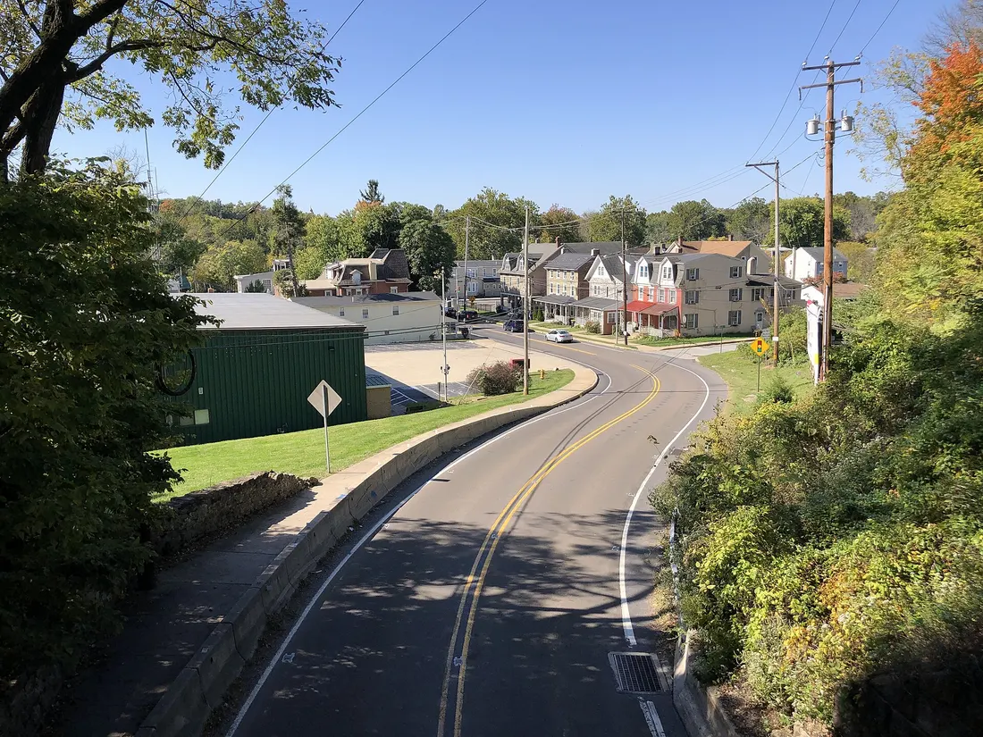 View south along Pennsylvania State Route 29 (Bridge Street) from the overpass for the rail line between Amelia Street and Sowers Street in Upper Providence Township, Montgomery County, Pennsylvania