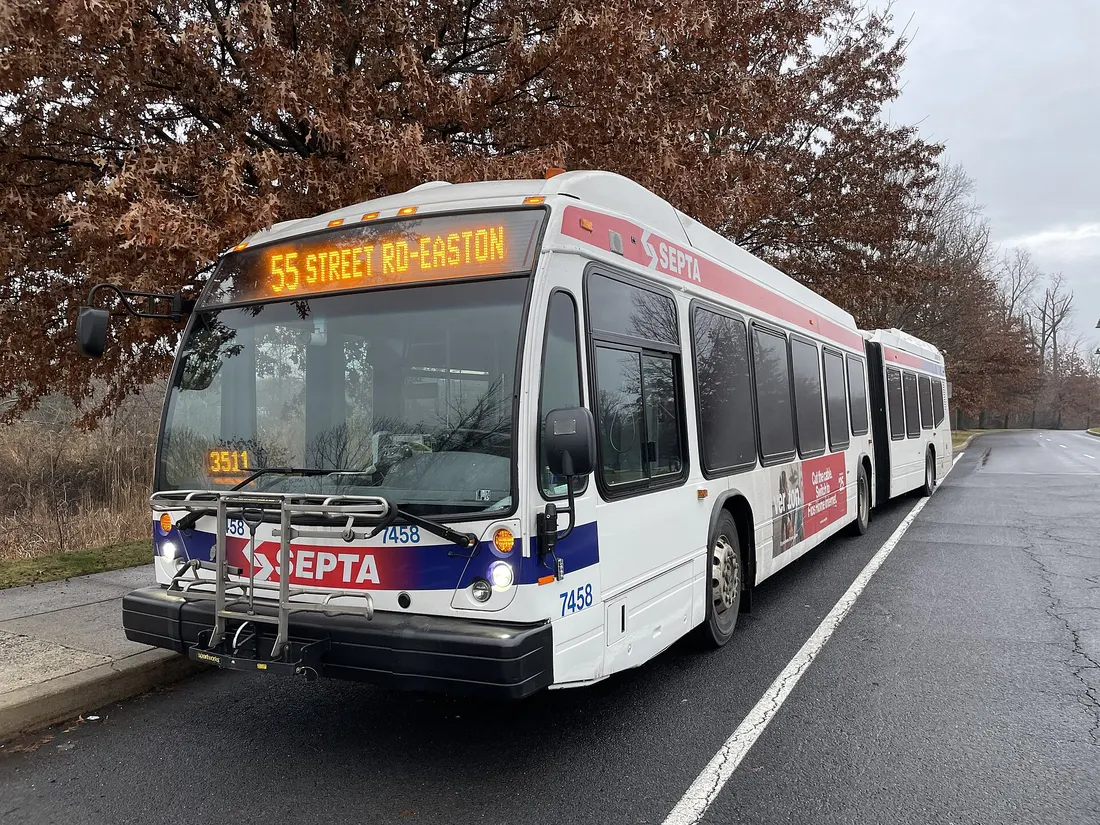 SEPTA NovaBus LFSA HEV #7458 on the Route 55 line at Valley Square Boulevard and Main Street in Warrington, Pennsylvania