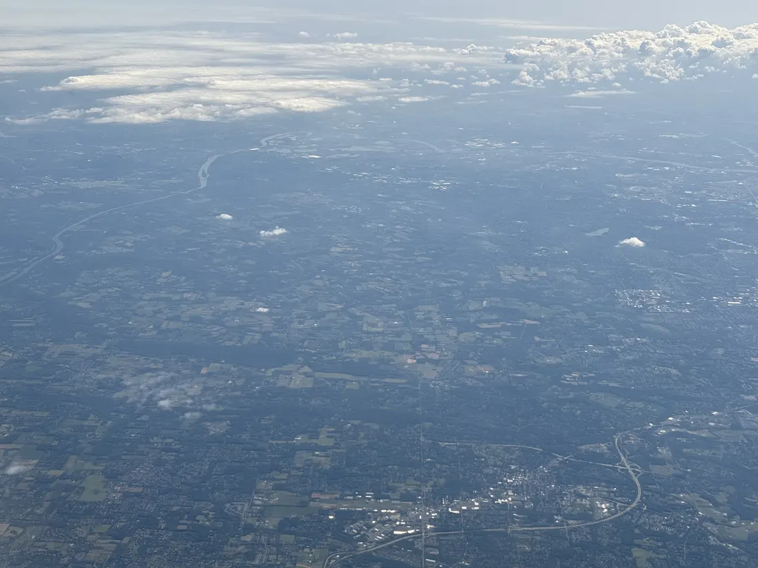 Distant aerial view southeastward centered on Wrightstown Township, Bucks County, Pennsylvania (with many surrounding areas visible) seen from an aircraft which departed from Newark Liberty International Airport