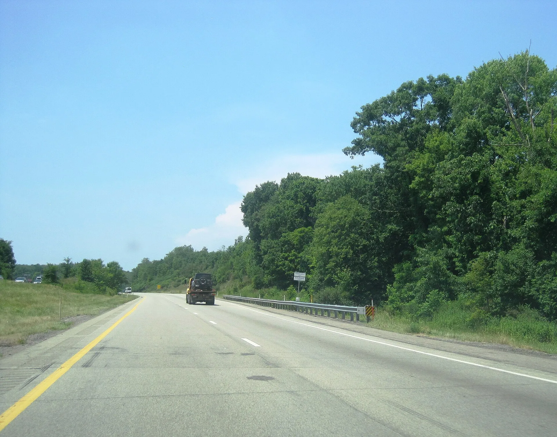 Photo of westbound Interstate 80 entering Scrubgrass Township , Venango County from Allegheny Township , Butler County , Pennsylvania . Photo taken looking west-northwest between Squaw Valley Road and exit 42 for Pennsylvania Route 38 .