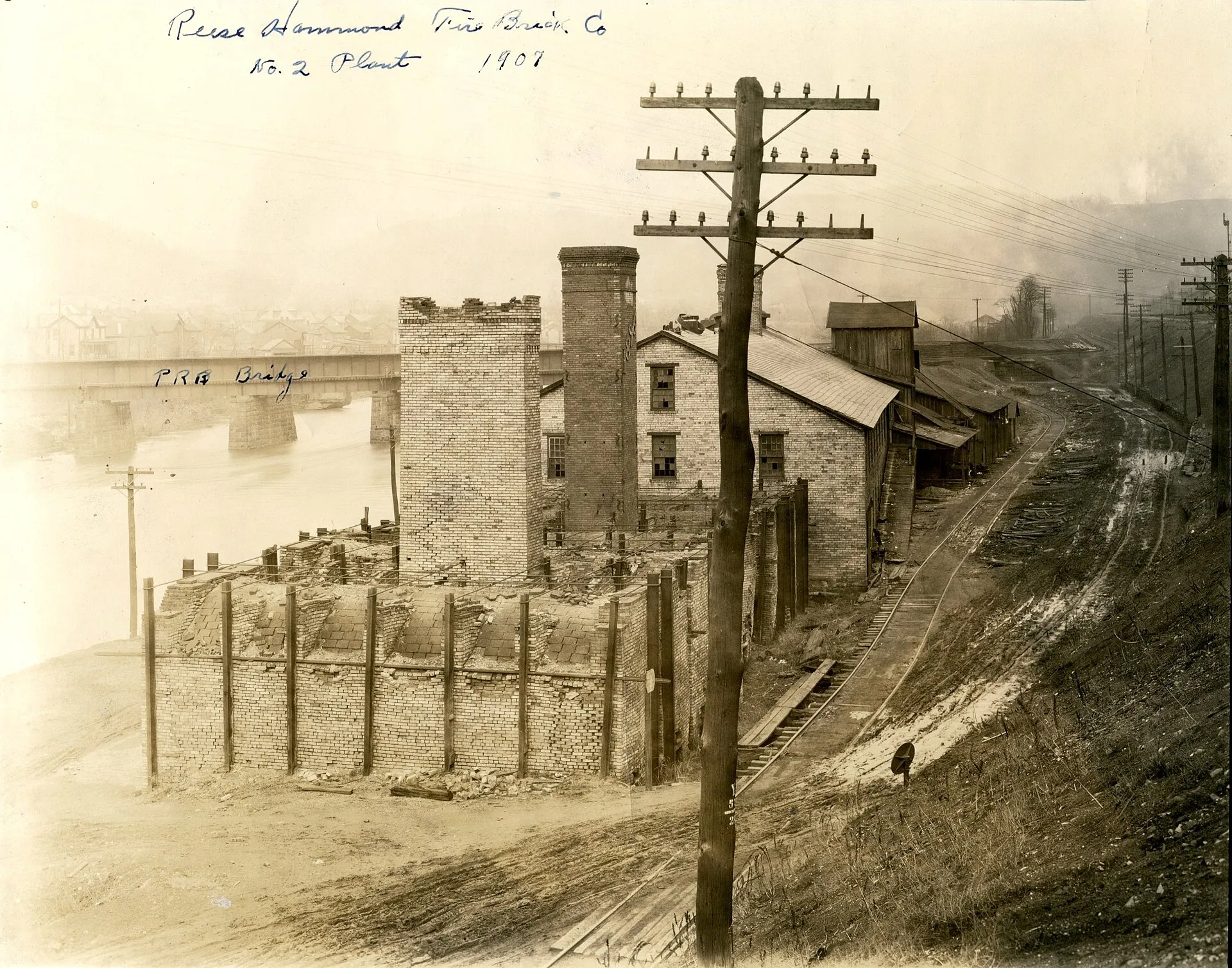 Photograph of one of the brick manufacturing plants that operated in Bolivar, PA in 1907. This facility was located on the South bank of the Conemaugh River just to the west of the currently existing railroad bridge (shown in the photograph).