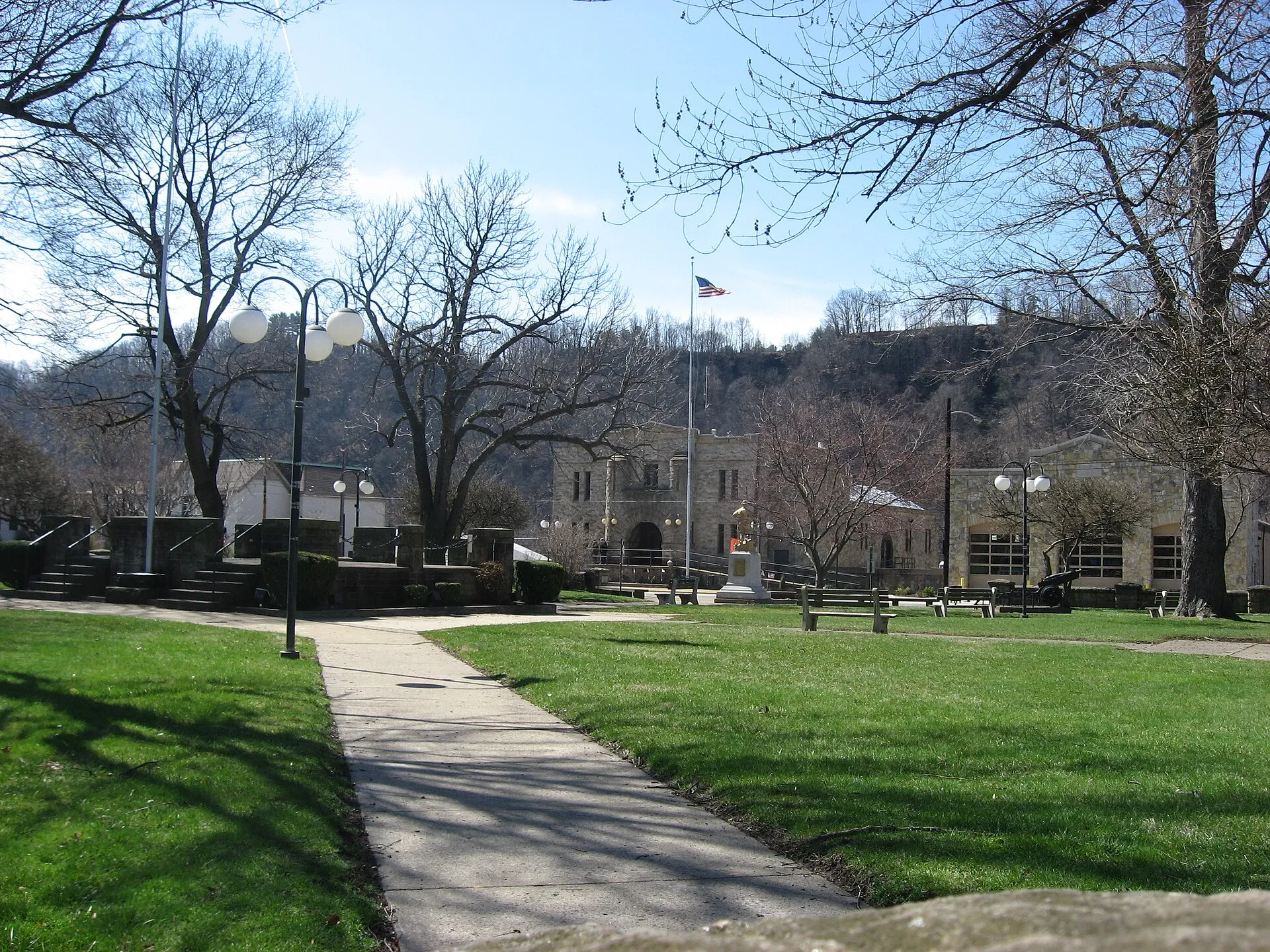 Community park in New Brighton , Pennsylvania , United States , with the borough building and fire department in the background. Park is surrounded by Sixth and Mulberry Streets and Third and Fourth Avenues.