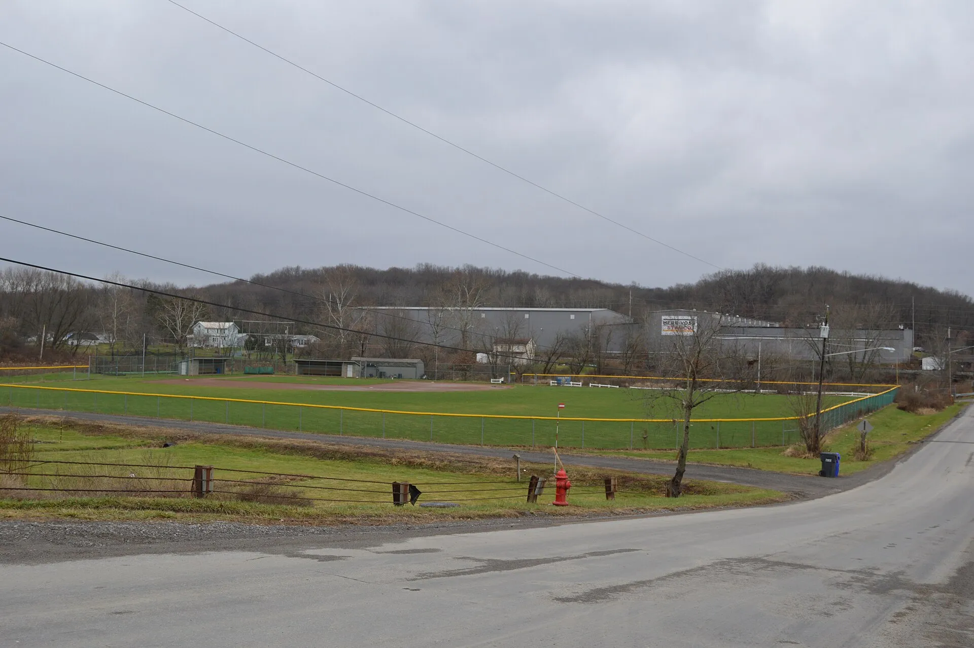 A ballfield and factory in Callery , Pennsylvania , United States . Picture looks west-southwest along Center Street.