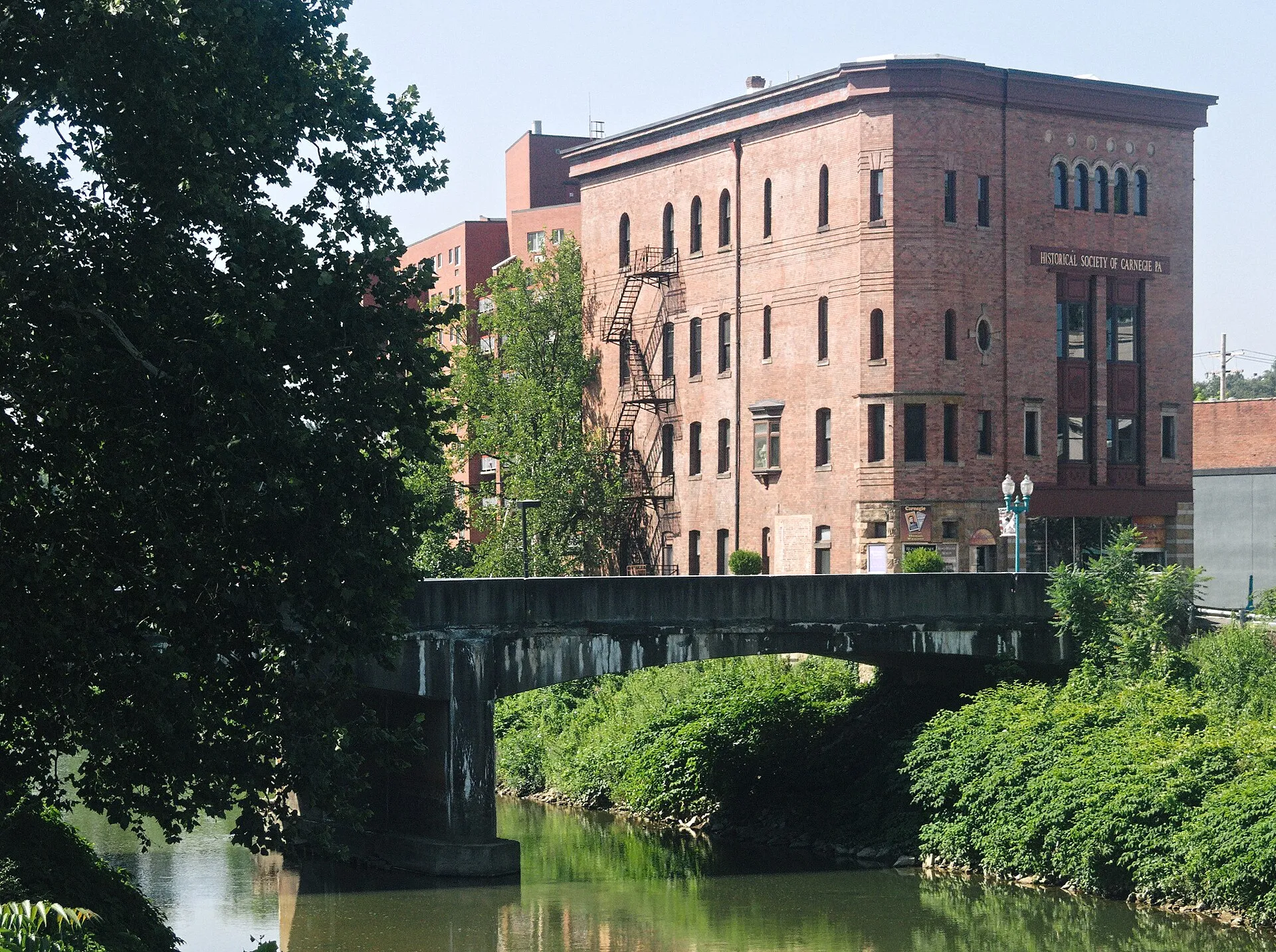 Chartiers Creek and the Main Street bridge, with the Husler Building at right