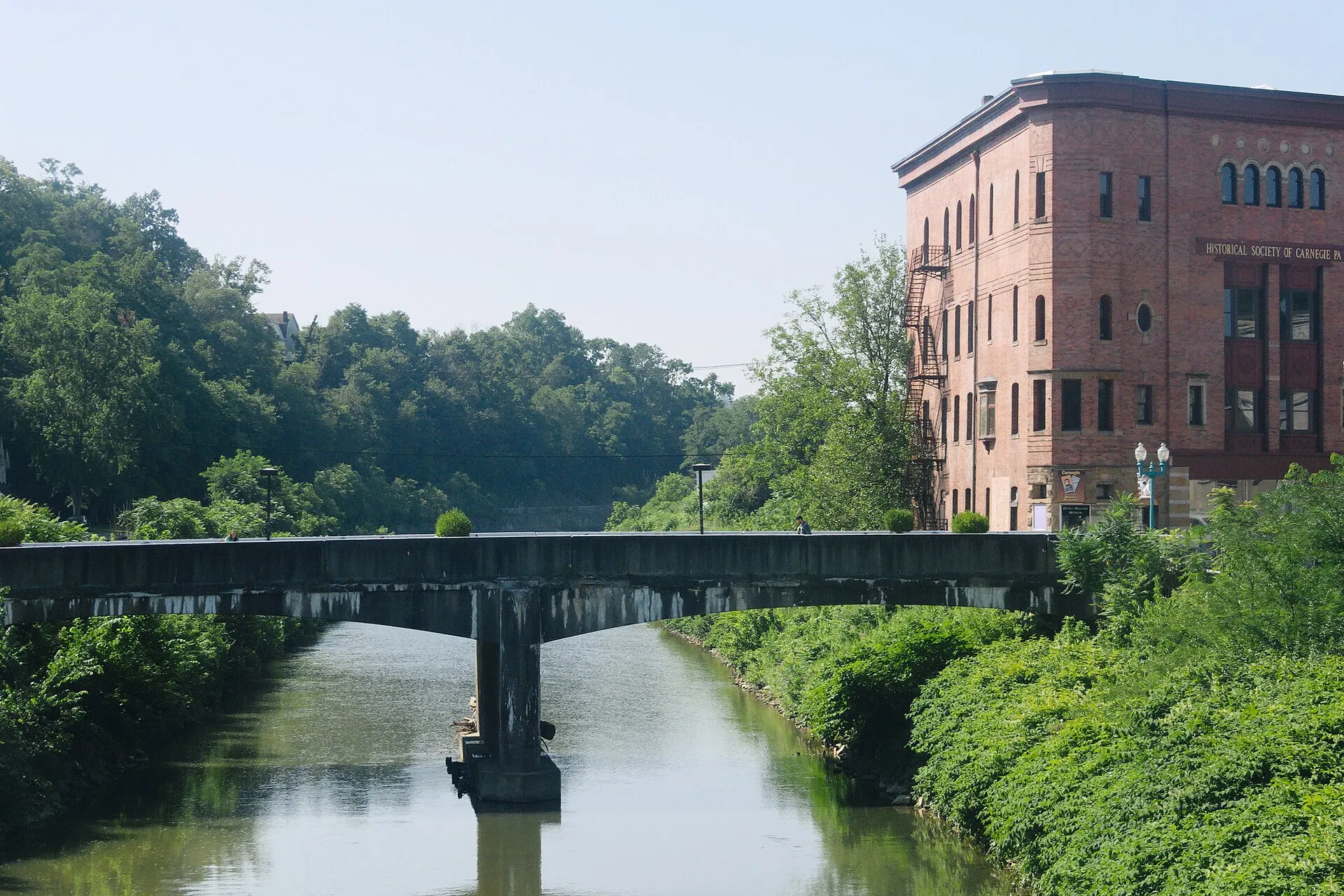 Chartiers Creek and the Main Street bridge, with the Husler Building at right