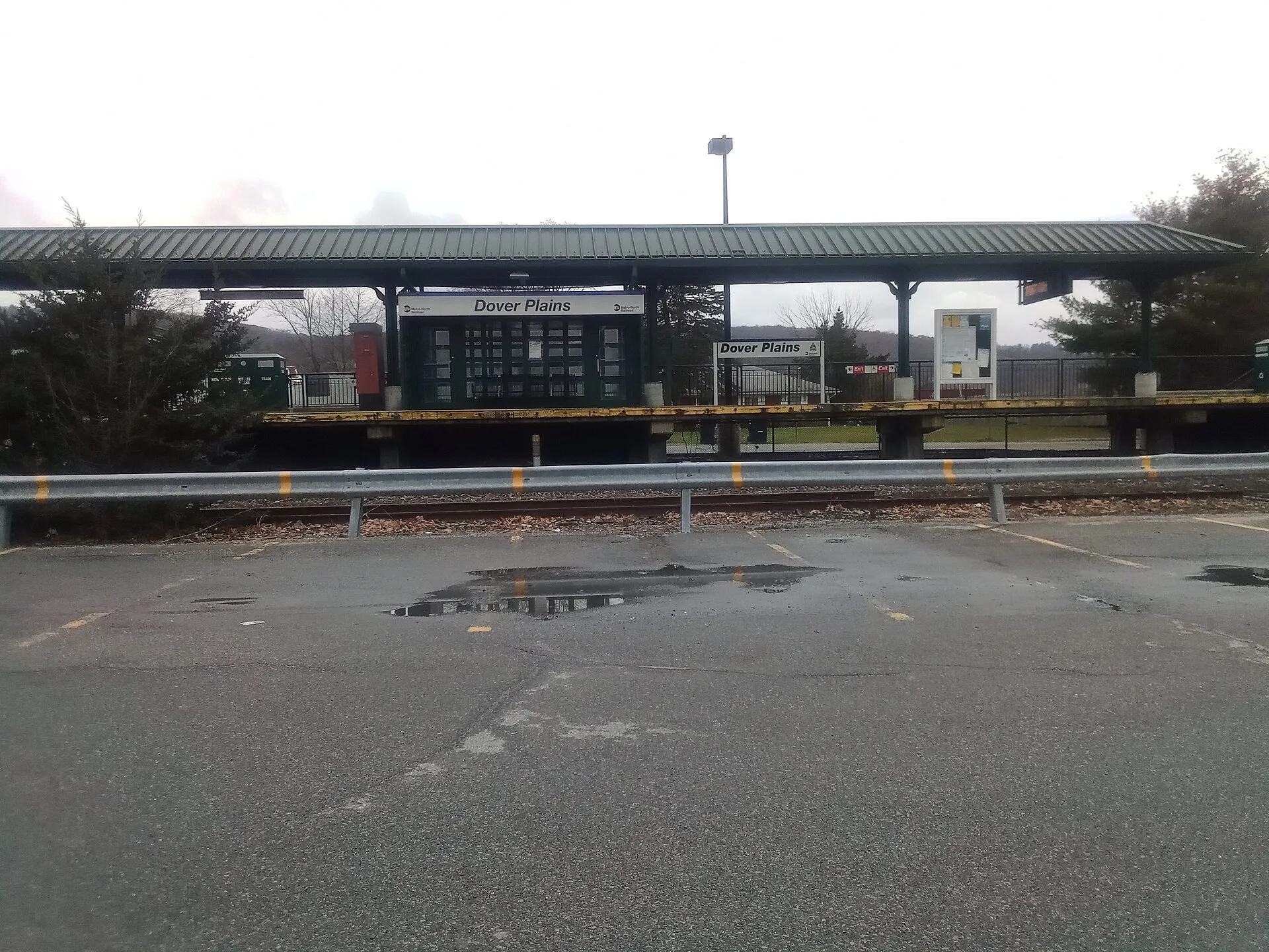 Standard Metro-North Helvetica Italic sign on the enclosed shelter on the platform of the Dover Plains Metro-North Railroad station in th