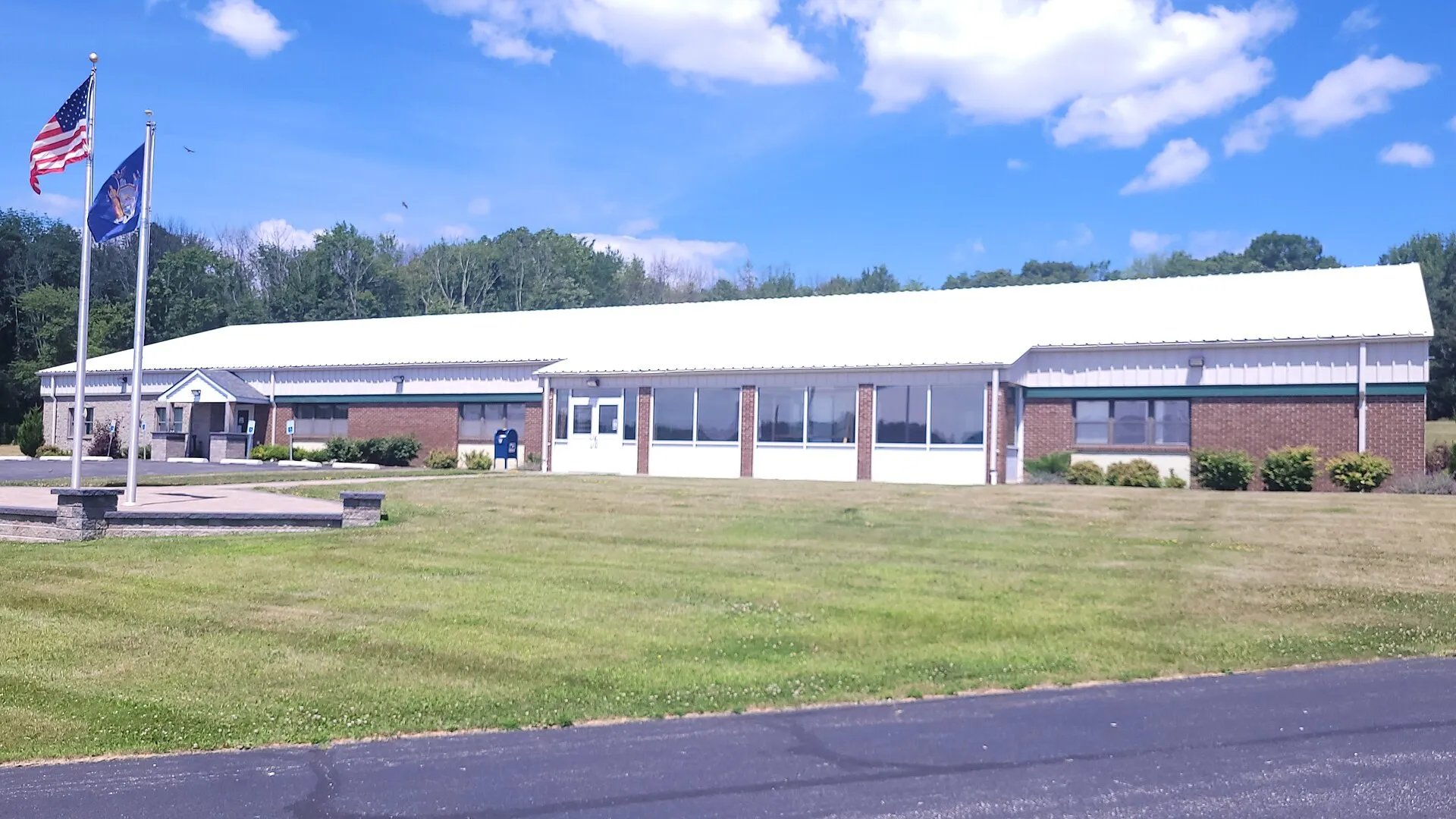 The Town Hall of Greenville, New York taken at a angle on a sunny day