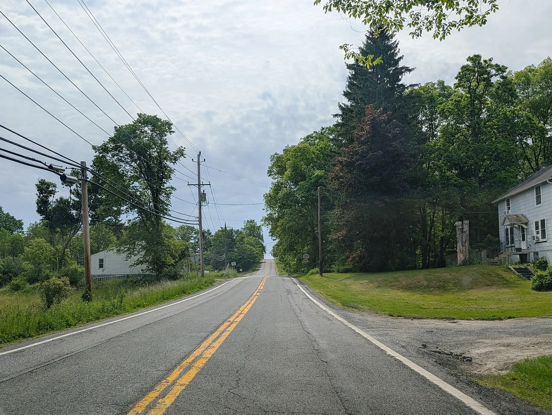 Photo of eastbound New York State Route 211 in the Town of Mount Hope , New York . Photo taken looking east-southeast between White Bridge Road and Pierson Hill…