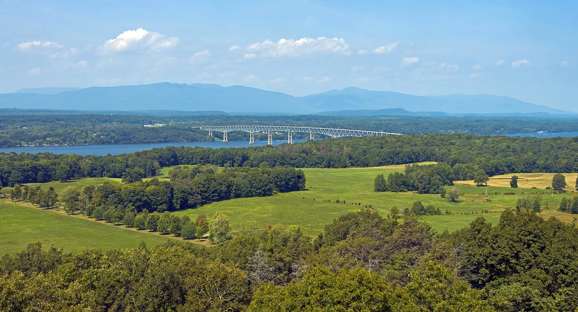 The lower Catskill Escarpment and Kingston–Rhinecliff Bridge over the Hudson River seen from the fire tower in Ferncliff Forest, Rhinebec