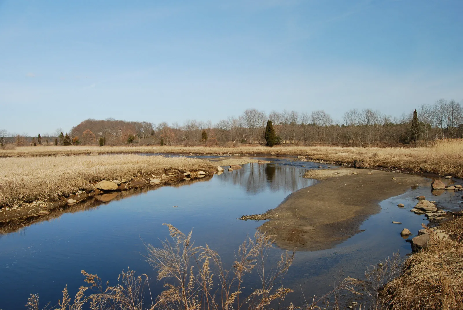View of Segreganset River at low tide, from Route 138 bridge in Dighton, Massachusetts.