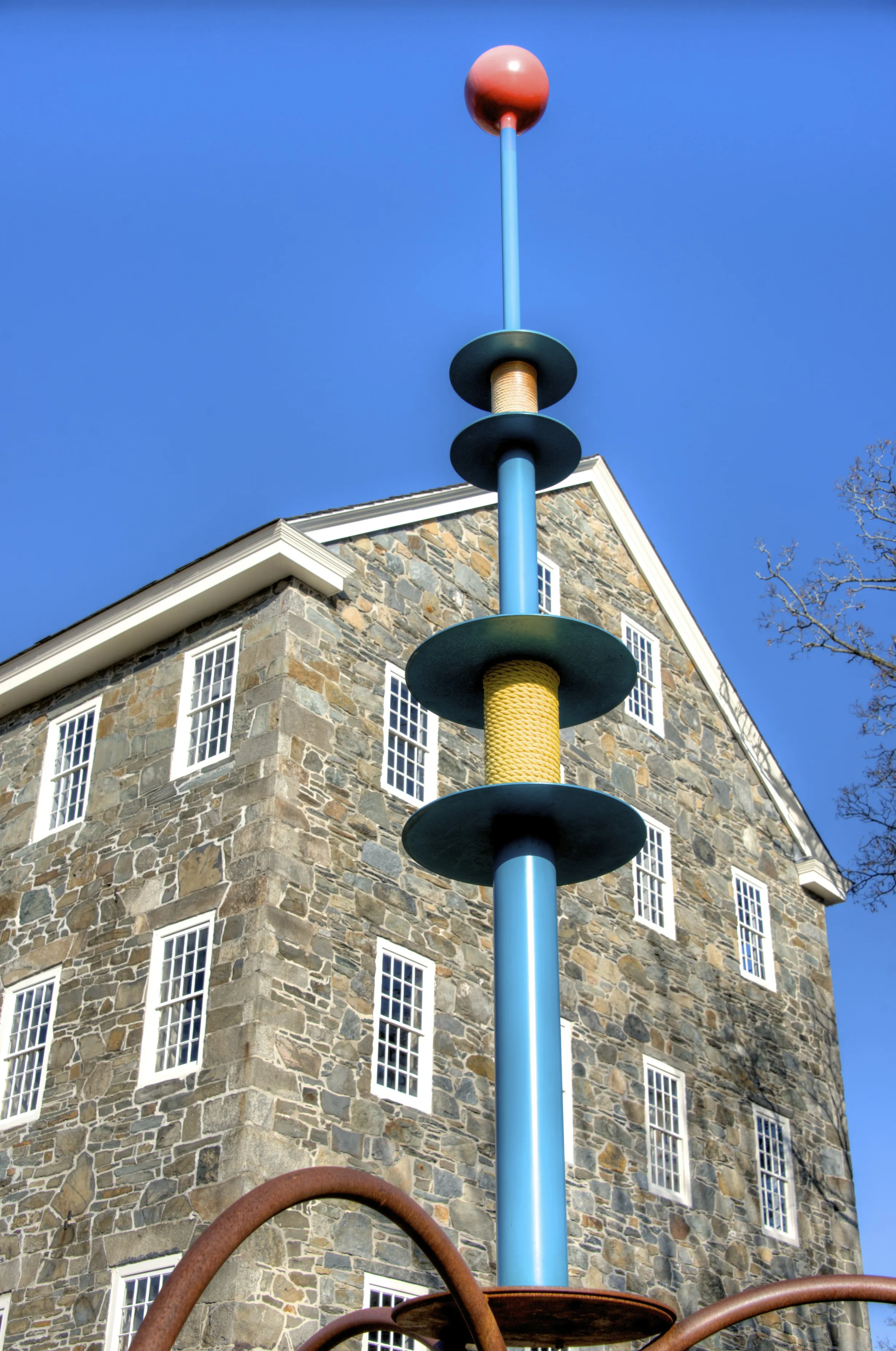 'The Bobbin' sculpture (22 feet tall) by Pawtucket artist Donald Gerola, in front of Wilkinson Mill.