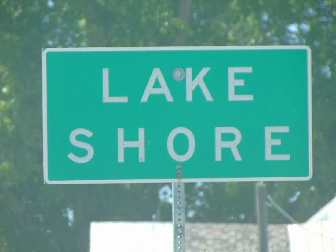 The sign for Lake Shore, Utah westbound on West 4400 South (Utah State Route 77), just west of the Spanish Fork River, February 2016