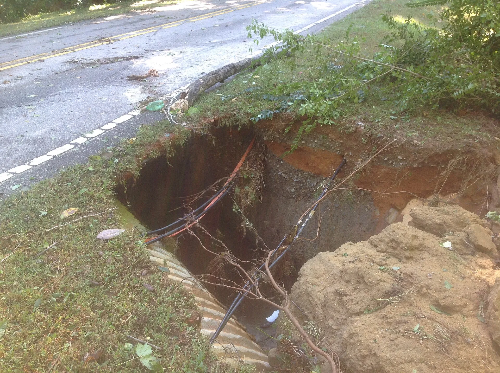 Photos of flooded and damaged roadways from Hurricane Matthew, which hit North Carolina Oct. 9, 2016.