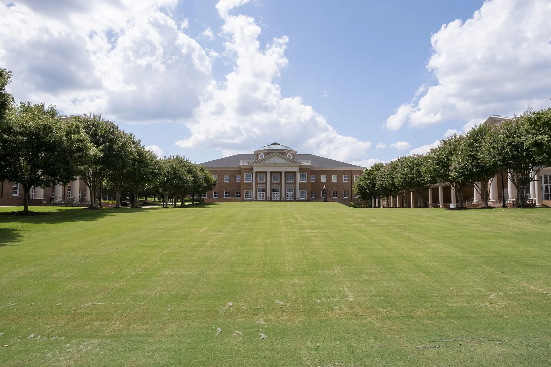 View of Cary Academy's main quad between the administrative building (center), Upper School (left) and Berger Arts Hall (right).