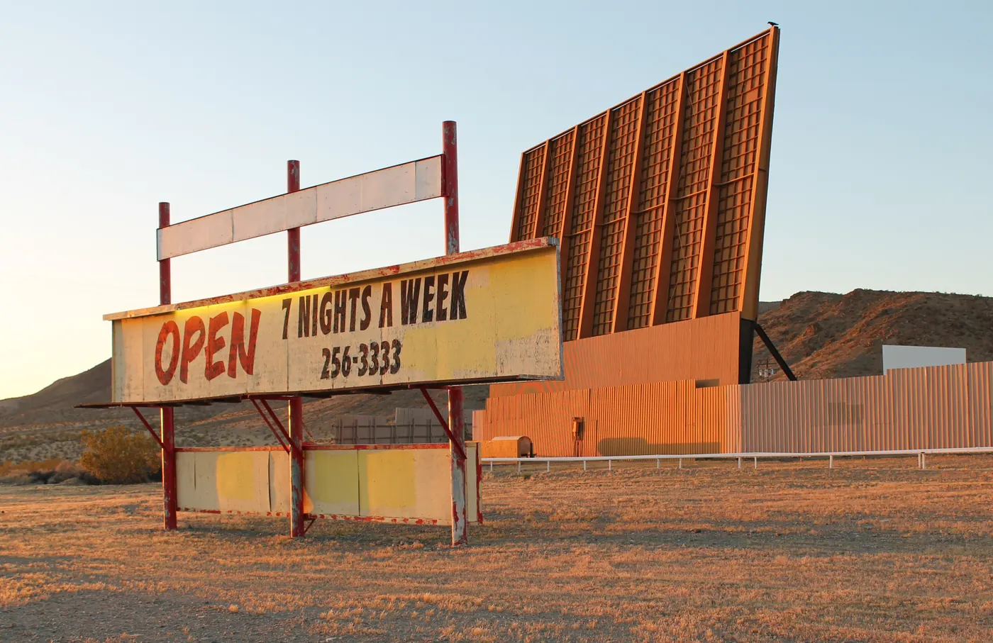 Skyline Drive-In Theater marquee and screens at sunset, Barstow
