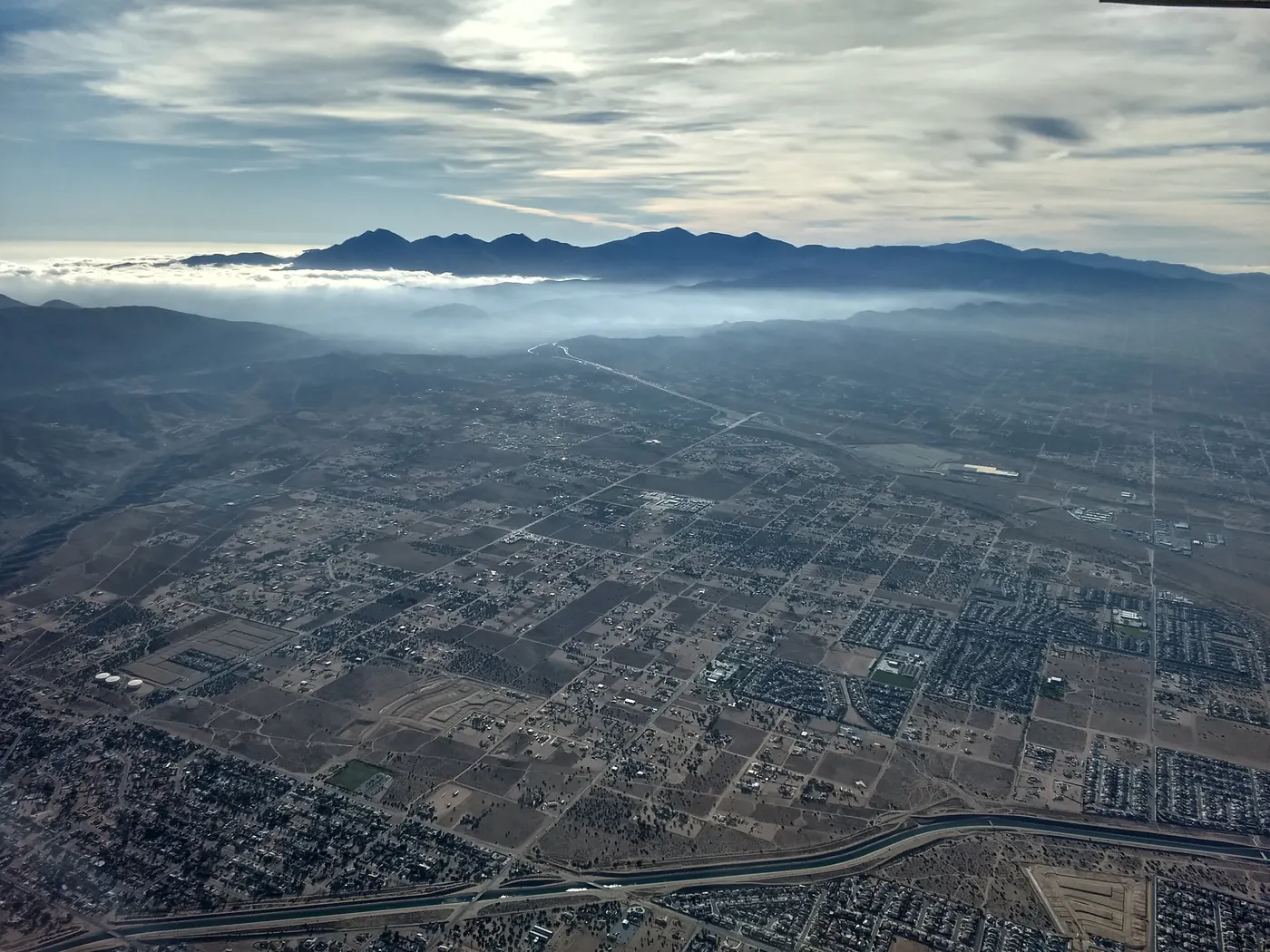 Hesperia from the air with the California Aqueduct in the foreground and the San Gabriel Mountains behind