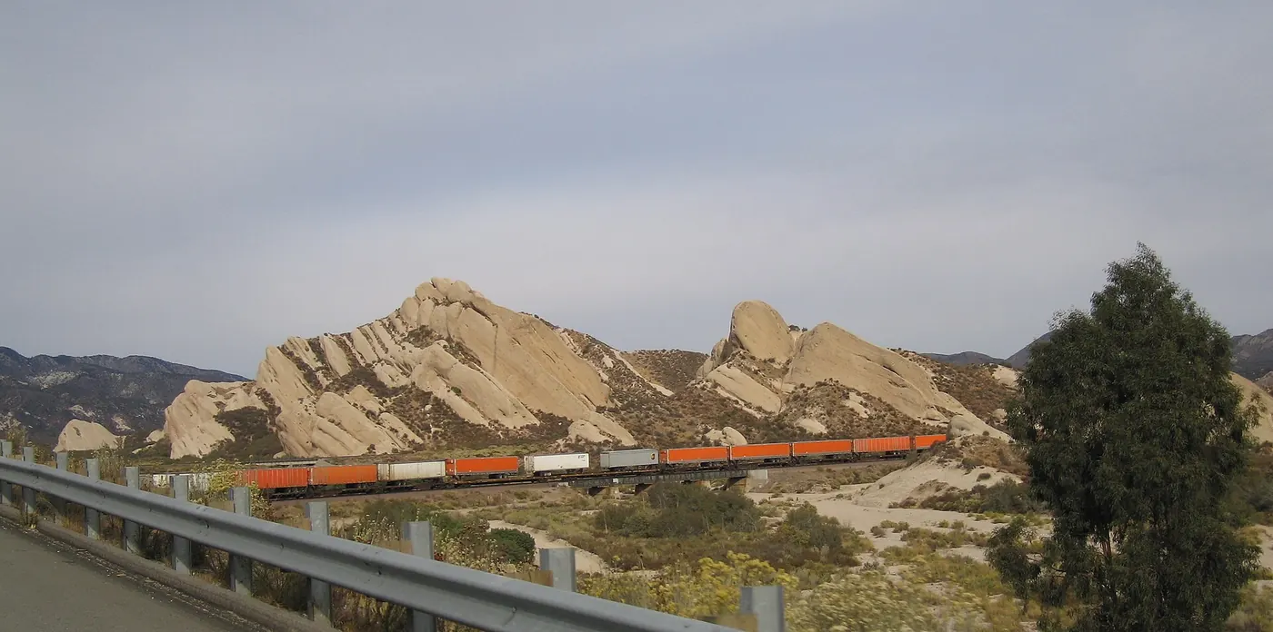 Mormon Rocks at Cajon Pass near Phelan, with a freight train