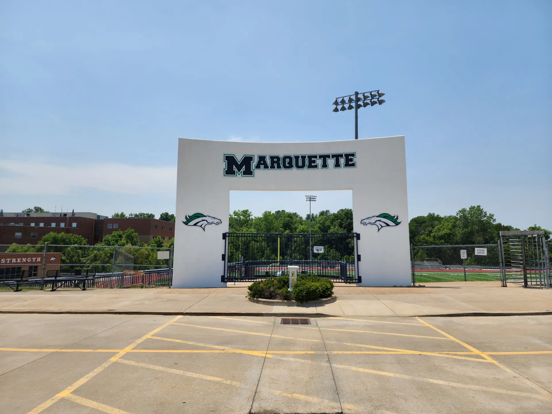Large sign above the entrance to the Marquette football field. [Marquette High School (Clarkson Valley, Missouri)]