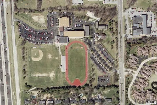 Satellite image of De Smet campus from 2002, before major construction added a new building and larger parking lots.