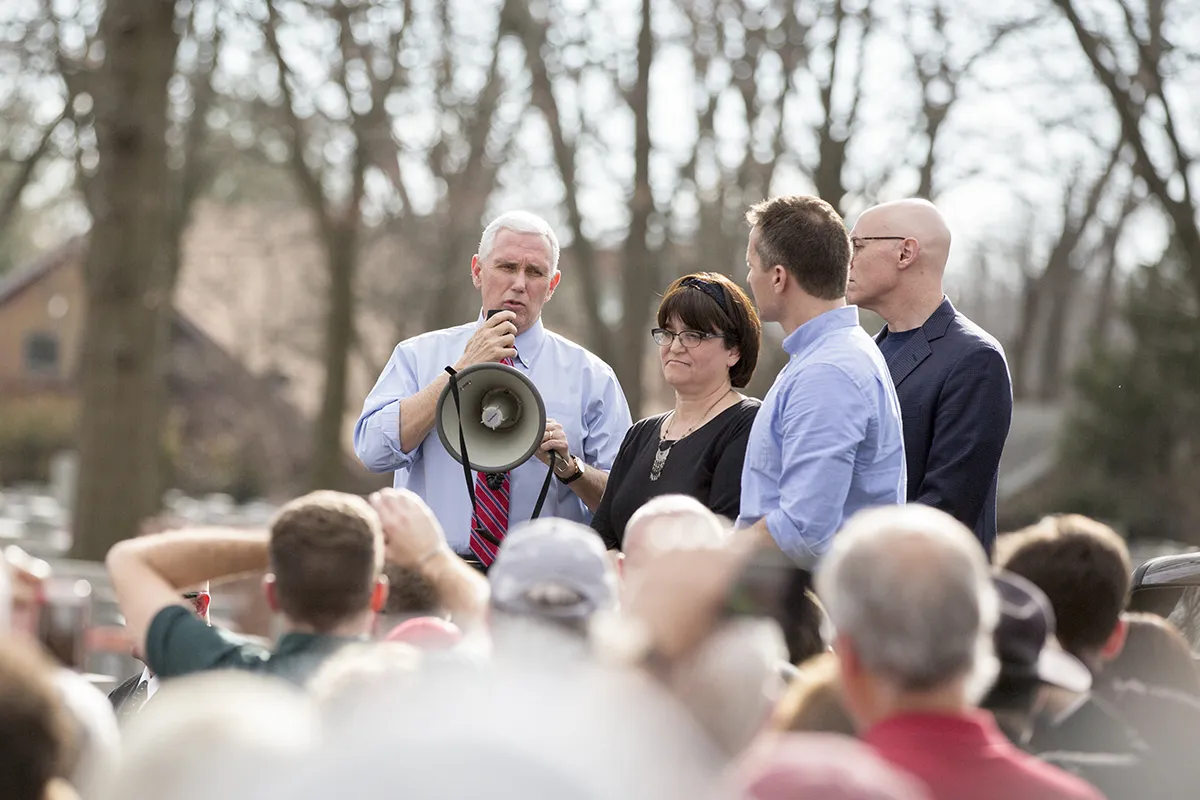 Vice President Mike Pence speaks to family members and volunteers during his visit to the Chesed Shel Emeth Cemetery, University City, Missouri, Wednesday, February 22, 2017, where vandals had toppled and damaged near...