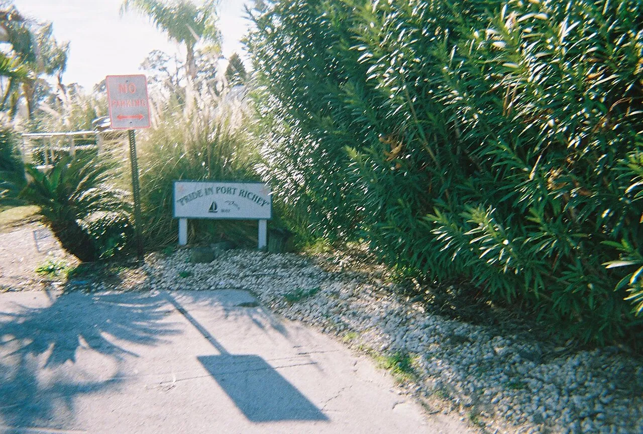 The former US 19 where it dead ends at the the Pithlachascotee River in Port Richey, Florida. A resturaunt and the Port Richey Marina are on each side of this. On the other side of the river is New Port Richey, Florida, where part of the old bridge i.
