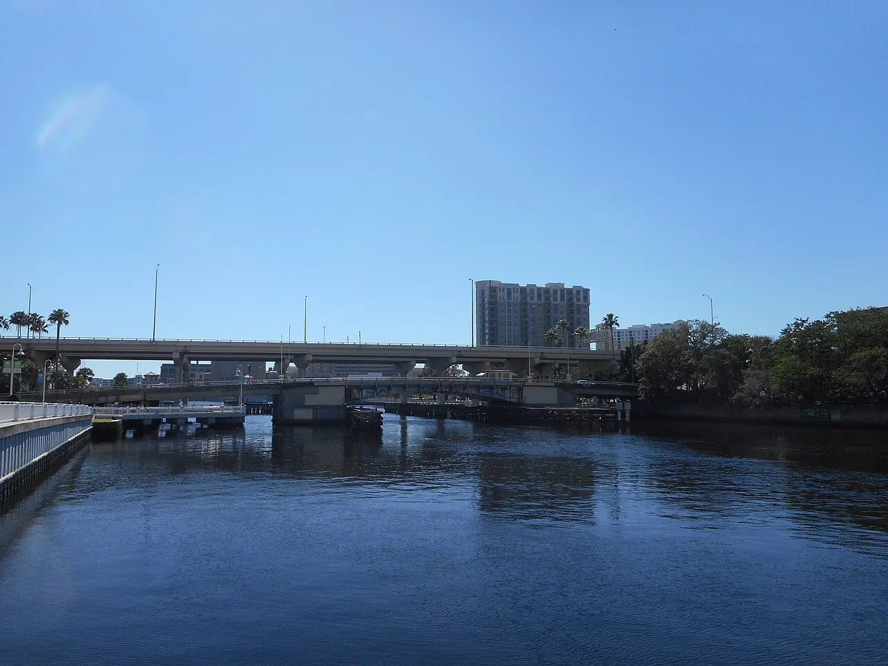 The Carl D. Brorein Street Drawbridge in Tampa, Florida, as seen from the edge of the Tampa Riverwalk with the Lee Roy Selmon Crosstown Expressway Viaduct in the background.